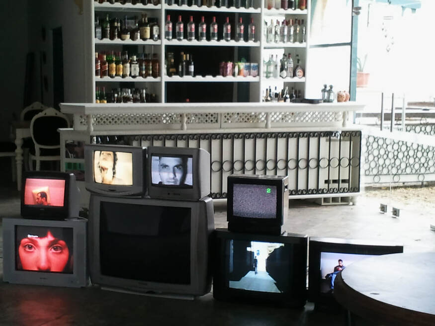 A Deserted Bar with 7 working CRT Televisions, Streetwalking