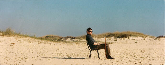 Siting on a lonely chair on the beach in Southern Portugal in the late 1990's