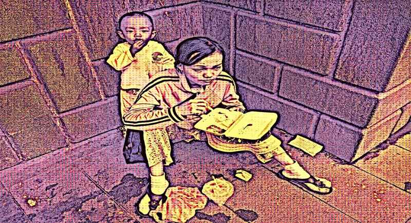 Homeless Mother and child on the streets, eating