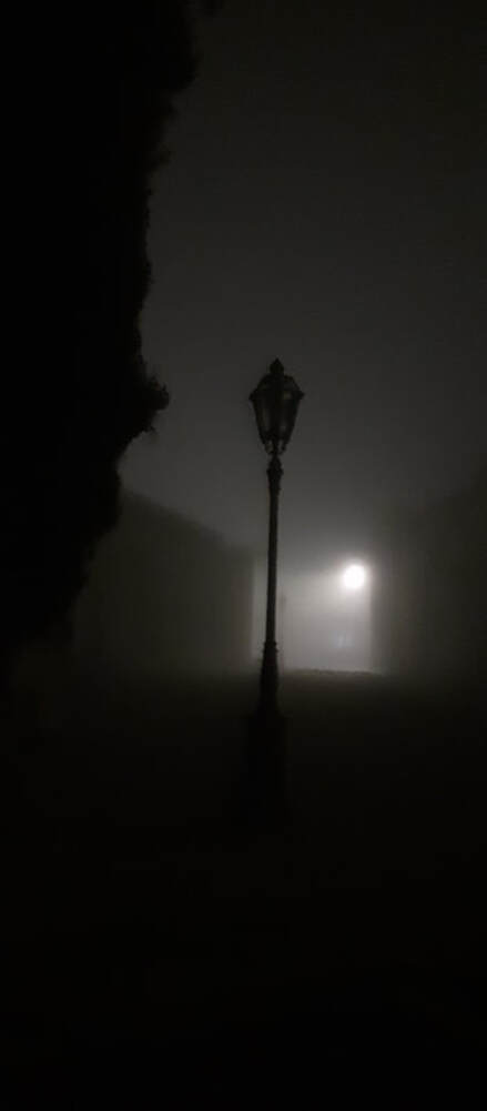 Night time fog on Ayios Stylianou with an unlit streetlamp, Strovolos, Cyprus