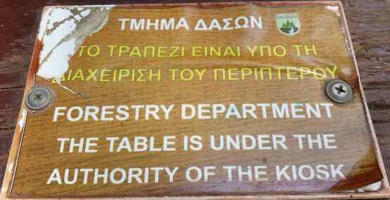 A forestry department sign saying the table is controlled by the kiosk.  Cyprus Parks