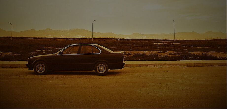 A photogenic shot of a elderly BMW520 with the Besparmak/ Pentadaktylos range in the background. On the Green Line area. South Cyprus